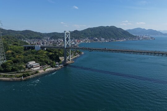 Aerial drone photo of Kanmon Bridge and Kanmon Strait, Shimonoseki and Mojiko, Japan