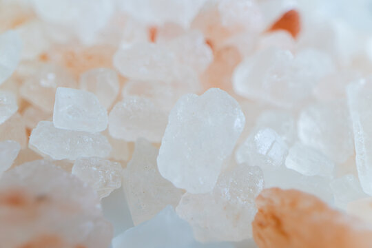 Macro photography of pink Himalayan salt crystals with soft lighting