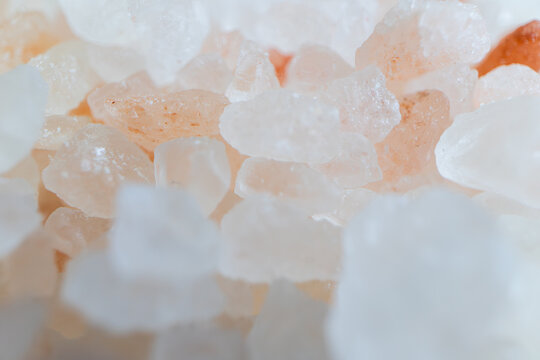 Macro photography of pink Himalayan salt crystals with soft lighting