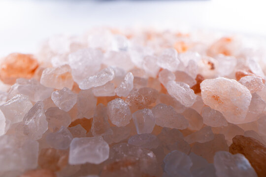 Macro photography of pink Himalayan salt crystals with soft lighting