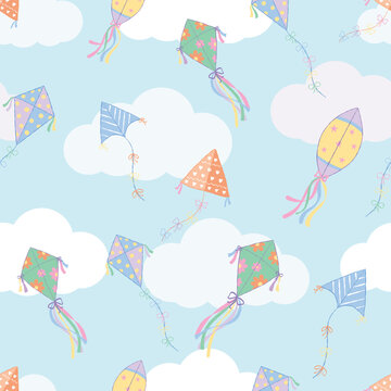 Colorful kites flying in the blue sky with white clouds seamless pattern