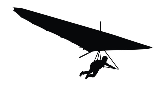 Silhouette of a person flying a hang glider in mid air