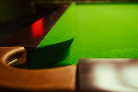 Snooker table. Focus on the cushion on a pool table