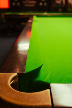 Snooker table. Focus on the cushion on a pool table