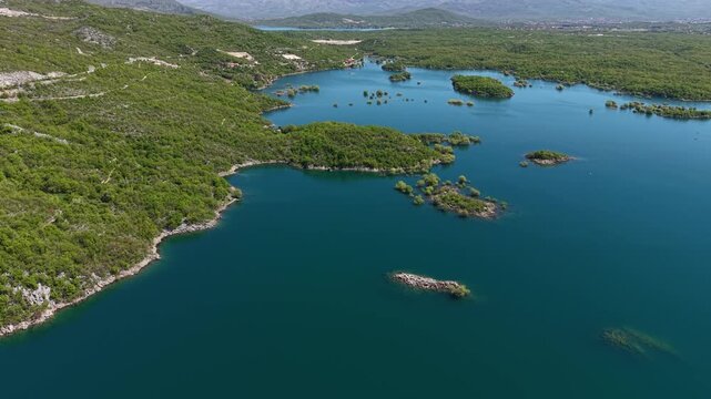 Slano Lake, Niksic Montenegro. Drone Shot of Rugged Coastline and Island in Water Reservoir