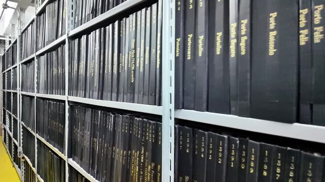 Archive Shelves with Black Binders in Registry Office Document Storage