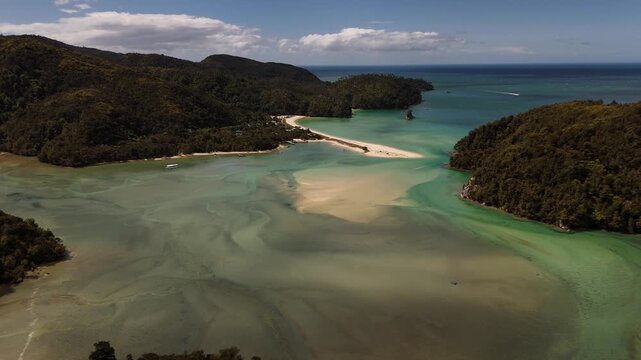Drone view of beautiful Torrent Bay with its sandspit and turquoise water at low tide in Abel Tasman National Park, New Zealand