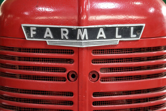 Perth, Western Australia, Australia - May 3 2026: 1946 International Farmall H. Close-up vintage tractor logo, emblem, symbol, brand name. Red color. Antique farming, agriculture history