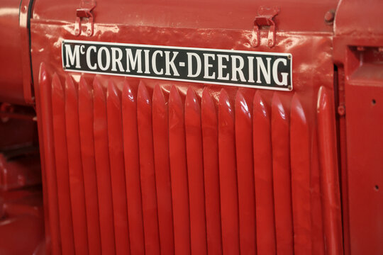 Perth, Western Australia, Australia - May 3 2026: 1936 McCormick Deering T20 Crawler. Close-up vintage tractor logo, emblem, symbol, brand name. Red color. Antique farming, agriculture history
