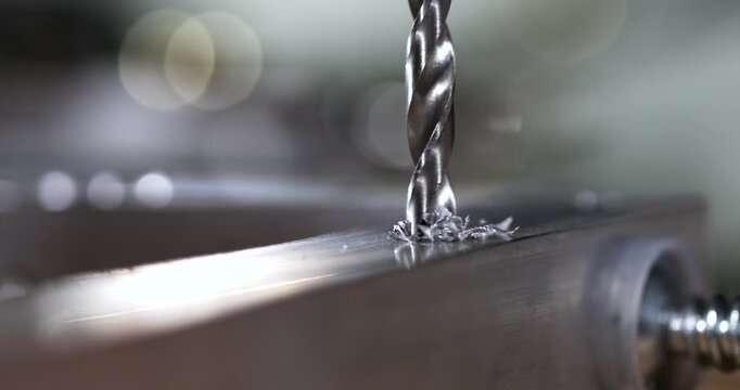 Super Slow Motion Vertical Drill Boring Through Metal Plate In Slow Motion