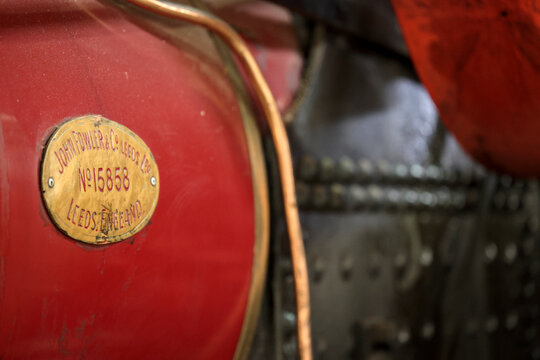 Perth, Western Australia, Australia - May 3 2026: John Fowler and Co Leeds Ltd steam engine. Close-up vintage tractor logo, emblem, symbol, brand name. Red color. Industrial heritage, antique farming