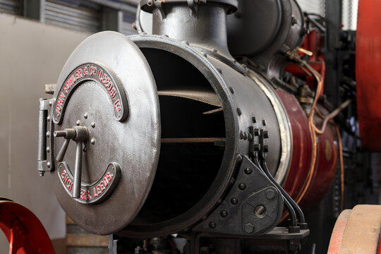 Perth, Western Australia, Australia - May 3 2026: John Fowler and Co Leeds Ltd steam engine. Close-up vintage tractor logo, emblem, symbol, brand name. Red color. Industrial heritage, antique farming