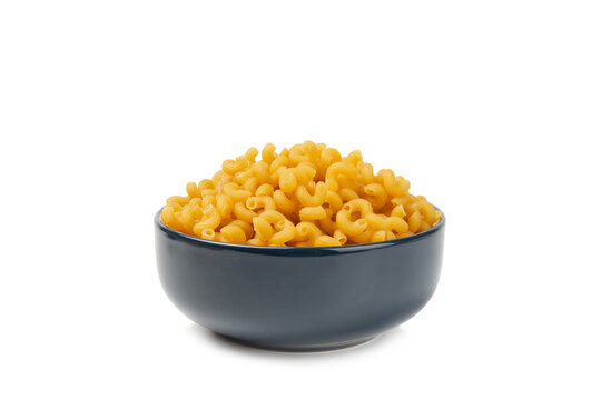 Raw Cavatappi pasta isolated on white background. tasty raw Cavatappi. close-up. Banner. Raw pasta in a jar, wooden spoon. Raw Italian pasta, European cuisine.  Design. 