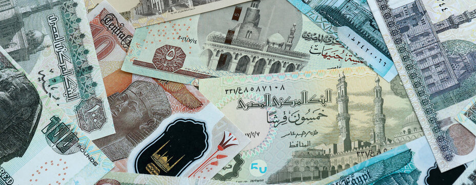 Egyptian pound money banknotes pile on table. Egypt bills of EGP currency. Concept of economy