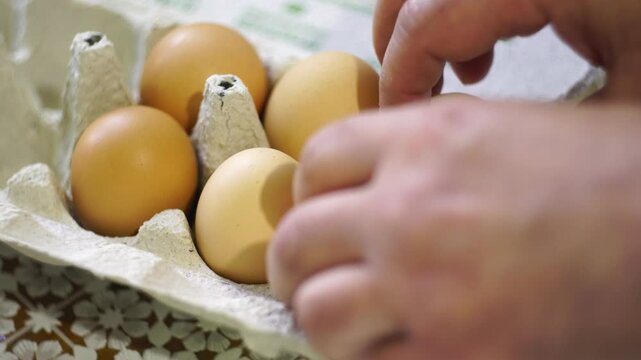 takes a few eggs from the package