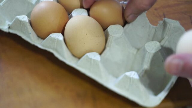 takes a few eggs from the package