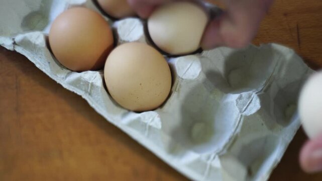 takes a few eggs from the package