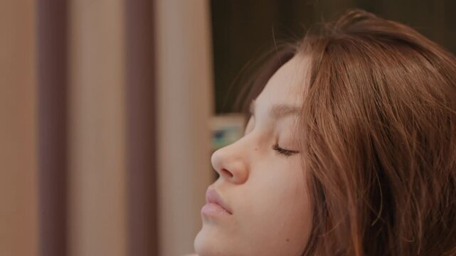White teen touching scalp in mirror, nervous morning gesture, fingers raking through brunette roots, indoor dorm background, tense expression, closeup emotion, private prep moment