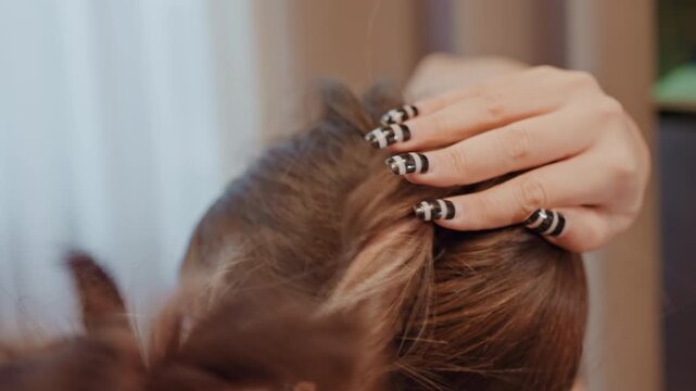 Rapid hair styling. Energetic hair grooming using accessories and mirror focus technique. Quickly arranging hair in energetic style with accessories while focusing on mirror reflection