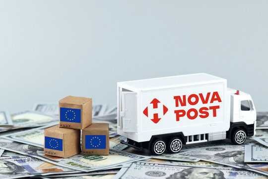 A white toy truck with the NOVA POST logo and boxes on a light background.
