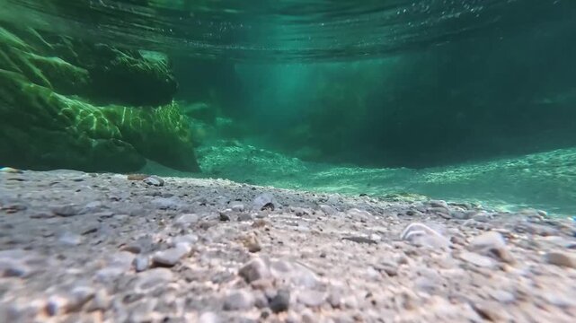 Spectacular images of the Torre River's whirlpools in Friuli. Above and below the water. The wild nature of the Julian Prealps.