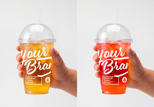 Hand holding iced drink in plastic cup