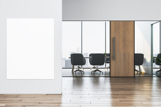 Vertical blank poster mockup on clean office wall near modern glass corridor with corporate meeting room view and wooden door in bright space. 3D Rendering