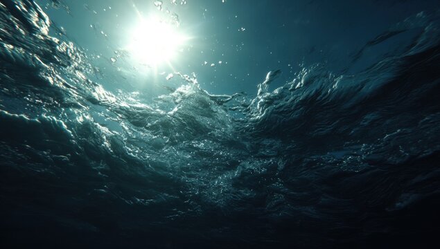 Underwater Sunlight Rays Breaking Through Ocean Surface Waves.