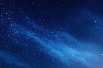 Obraz premium Deep blue expanse of the night sky filled with countless sparkling stars and nebulae