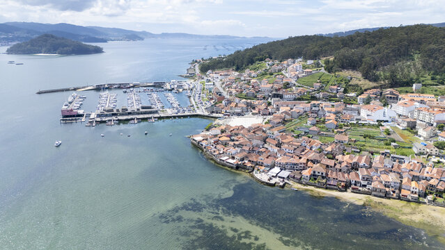 Aerial view of the historic coastal village of Combarro with its traditional stone houses and marina along the Ria de Pontevedra Combarro, Pontevedra, Spain.