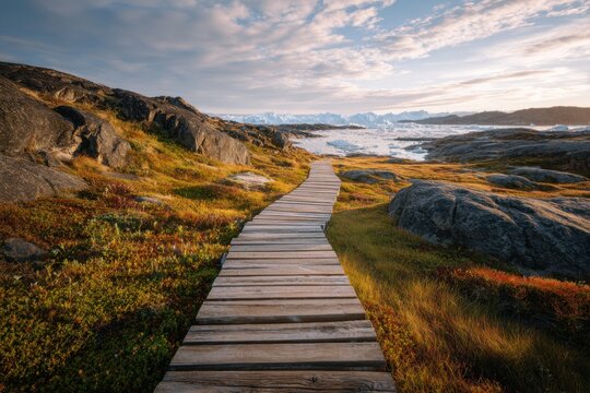Wooden Boardwalk Path Through Autumn Arctic Landscape Under Dramatic Sky.