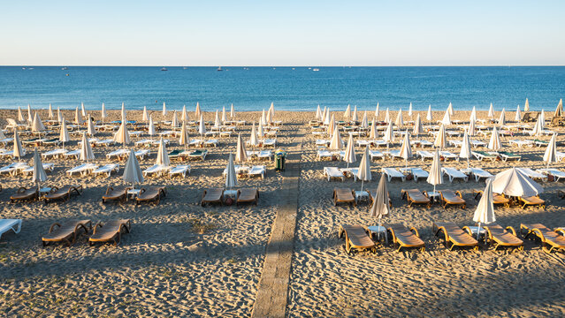 Rows of Empty Sunbeds and Closed Umbrellas on the Beach in Alanya Turkey