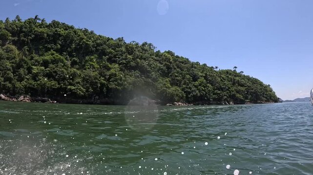 View of the sea and blue sky from inside the boat. In slow motion.