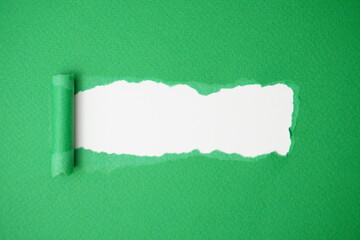 Green ripped paper. Hole from green torn paper with copy space. © BEN HDA