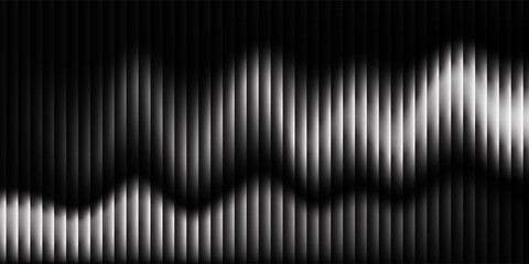 A striking abstract image featuring monochrome wave patterns with dynamic gradient lines. The design creates a sense of movement and depth on a dark background. © agung