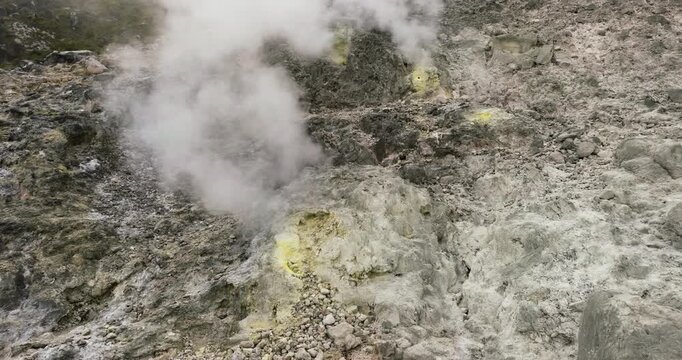 Sulphur and volcanic gases boil out of a fumarole vent on an active Sibayak volcano. Berastagi, Sumatra. Indonesia.