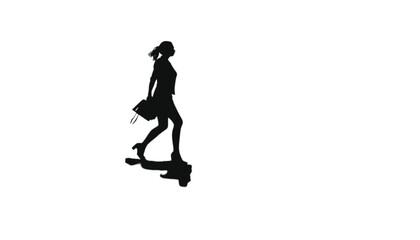 Obraz premium Businesswoman walking with a briefcase is depicted as a solid black silhouette isolated against a plain white background, symbolizing professional movement, determination, and a corporate career path.