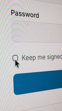 4K vertical macro view of unchecking a "Keep me signed in" box on a login screen with password field.