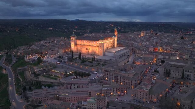 Aerial night view of the historic Toledo, Illuminated medieval city with Alcazar of Toledo Castilla-La Mancha, Spain.