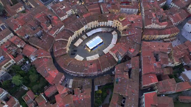 Aerial view of the main square, Piazza dell'Anfiteatro, in Lucca, Tuscany, Italy. Medieval Historical Center at Twilight