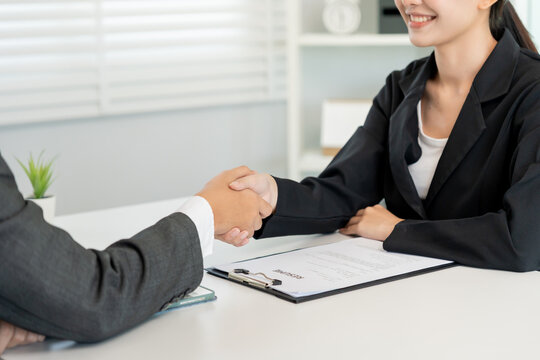 Executives accept job application and shake hand, documents and job applicants resume to match the position. company publishes vacancies online to find human. Human resource, interview, letter