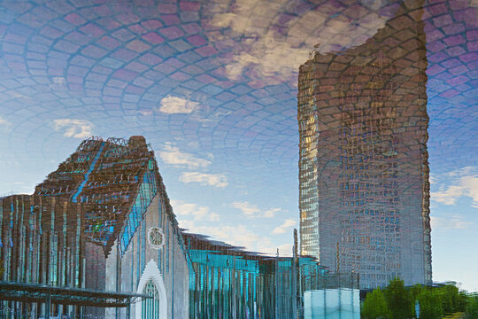 City of Leipzig - Germany. A panorama at sunset. Distorted reflection in the fountain.