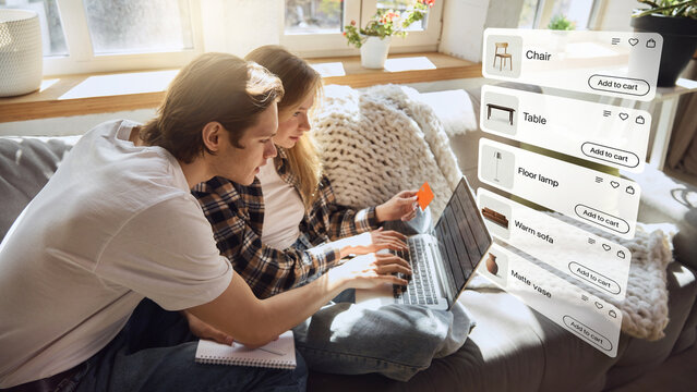 Couple choosing furniture online with laptop and floating ecommerce product cards at home. Concept of online shopping, home decor marketplace, retail app and digital customer journey.
