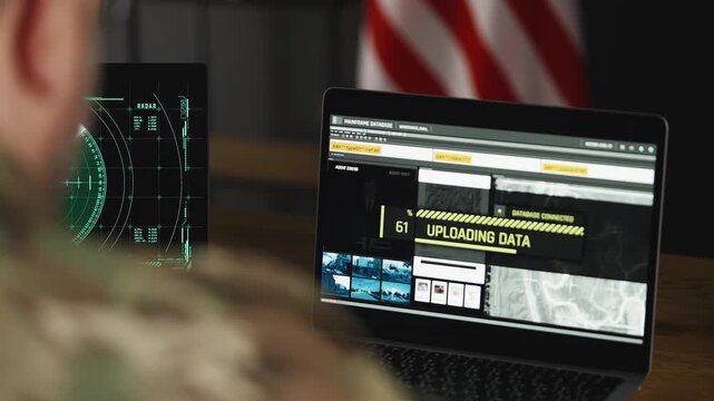 U.S. intelligence officer uploading satellite data on laptops, planning mission