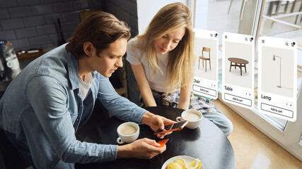 Naklejka premium Couple shopping for furniture online with floating ecommerce displays at home. Concept of digital storefront, interactive catalog, augmented shopping interface and home decor ecommerce.