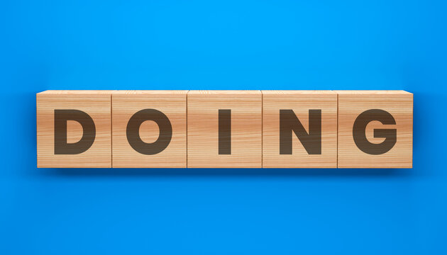 The Action Word: Five wooden blocks spell out the word DOING against a vibrant blue background, illustrating action, process and progress.