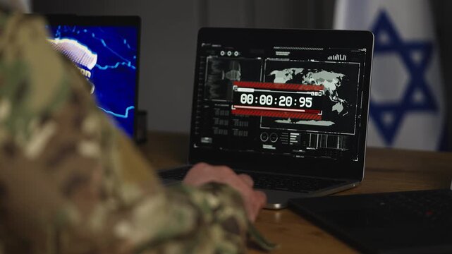 Israeli army officer monitors missile launch, start of ground offensive in Iran
