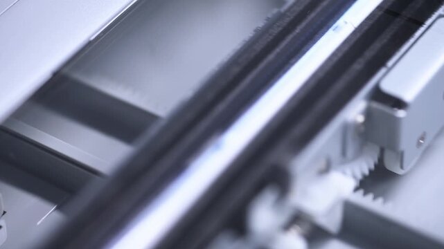 Close up of empty flatbed scanner glass and interior with soft lighting indoors