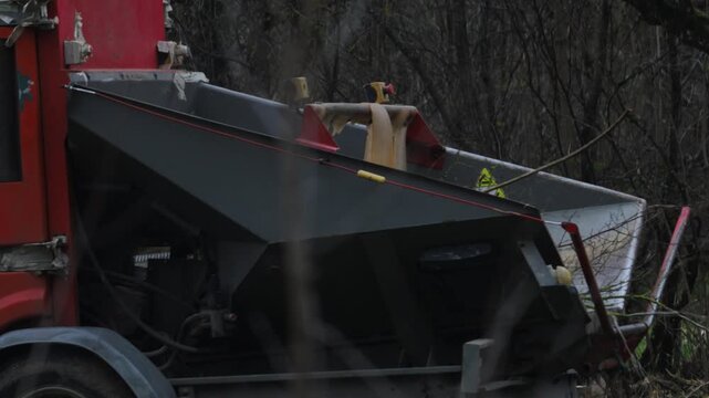 removing tree branches with a wood chipper