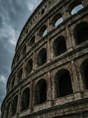 Obraz premium Ancient Roman Colosseum Under Dark Cloudy Sky colosseum